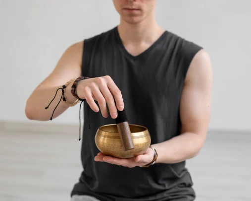 spiritual young man practicing yoga indoors